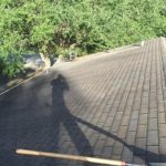roofer shadow on roof